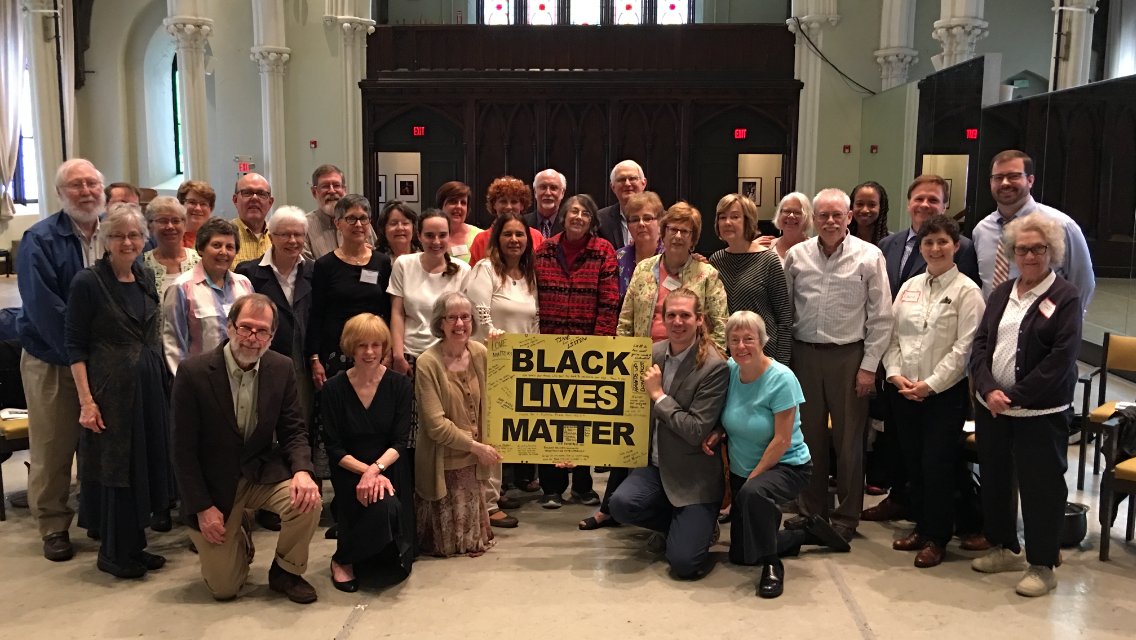 Congregation with BLM counter graffiti sign